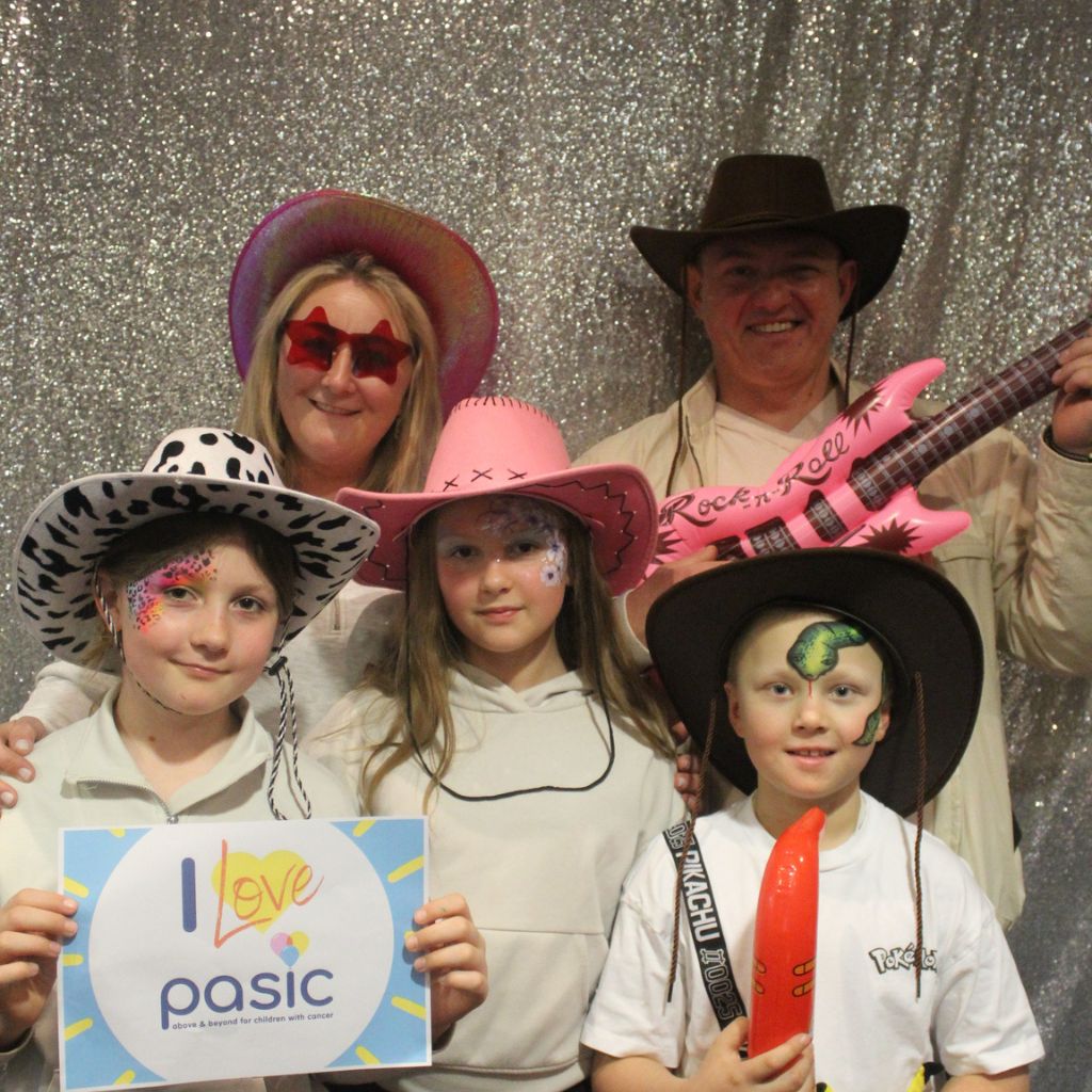 Family with Pasic sign