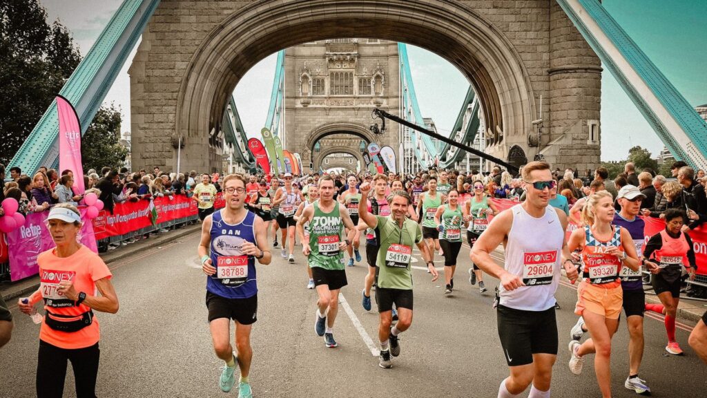 Runners pass over Tower Bridge
