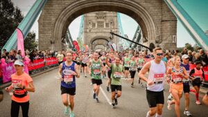 Runners pass over Tower Bridge